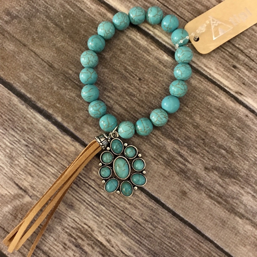 CONCHO TASSEL BRACELET
